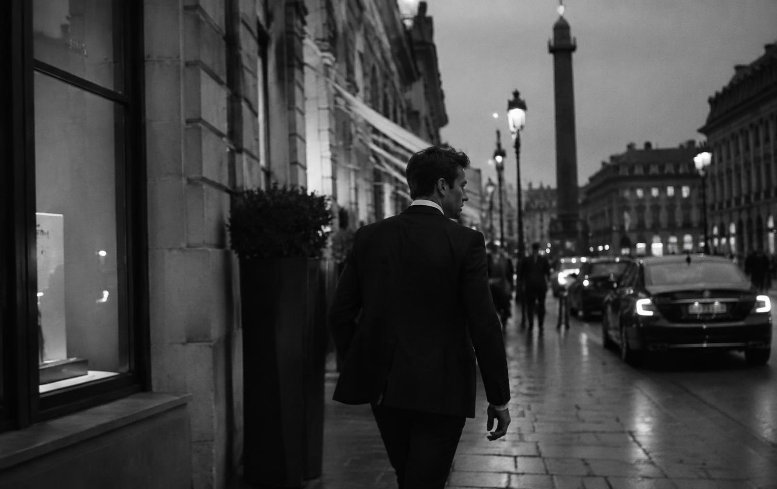 Trevor Daly walking through the city at dusk